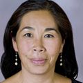 front facing image of woman smiling at camera