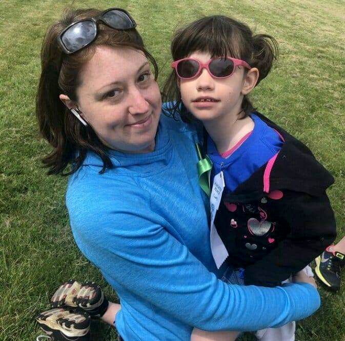sharon, holding her daughter