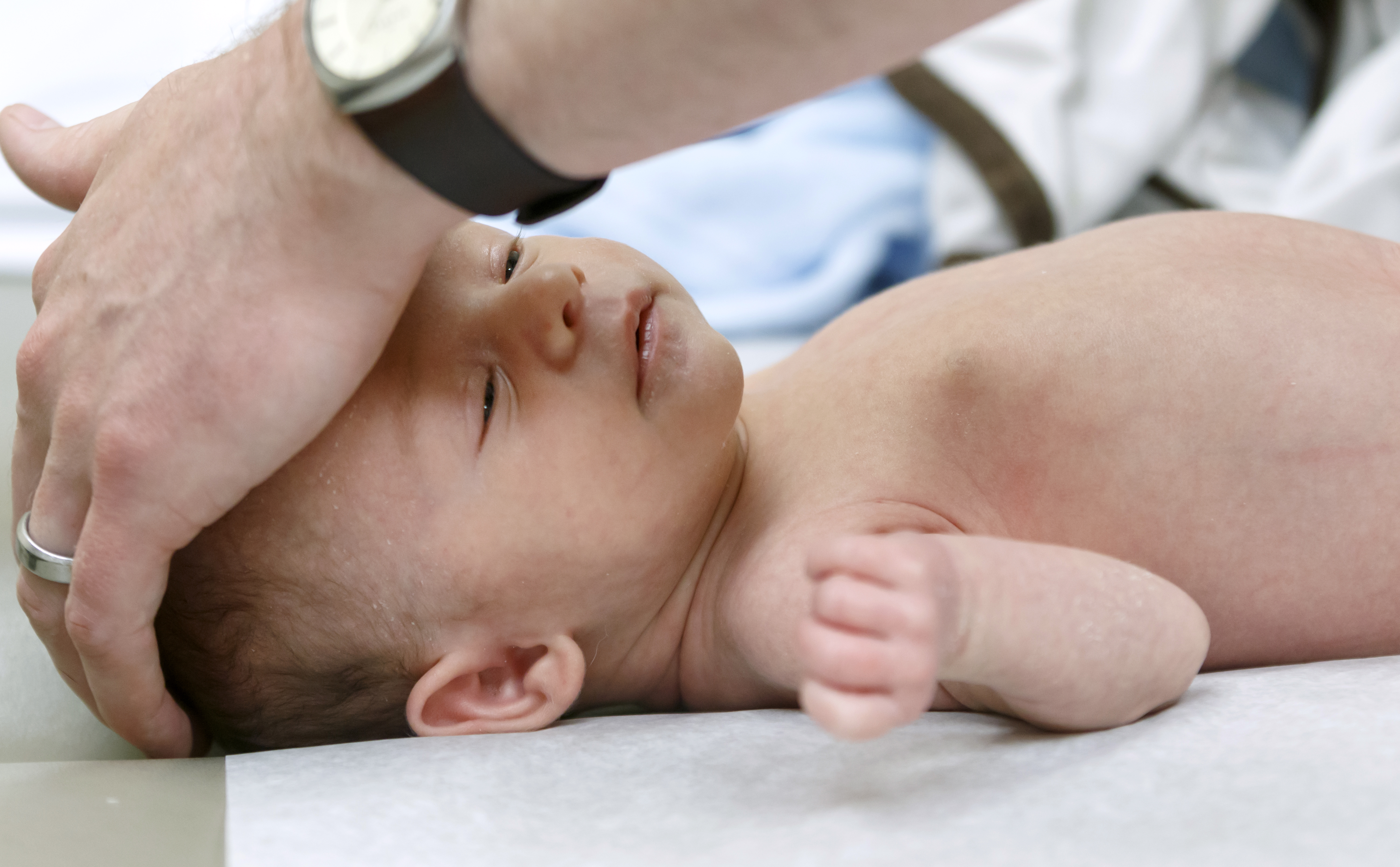 Baby being examined by a doctor