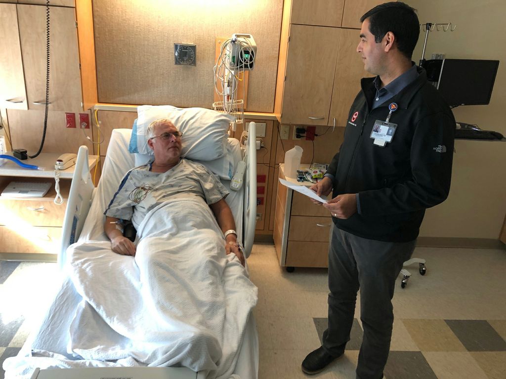 Man and doctor in hospital room