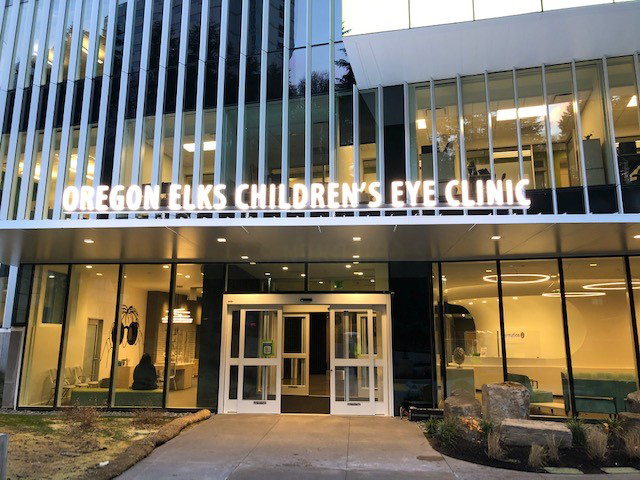 Front exterior shot of a building with lettering above the door reading "Oregon Elks Children's Eye Clinic"