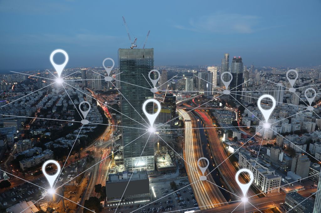 Aerial image of city with graphic lines connecting different points