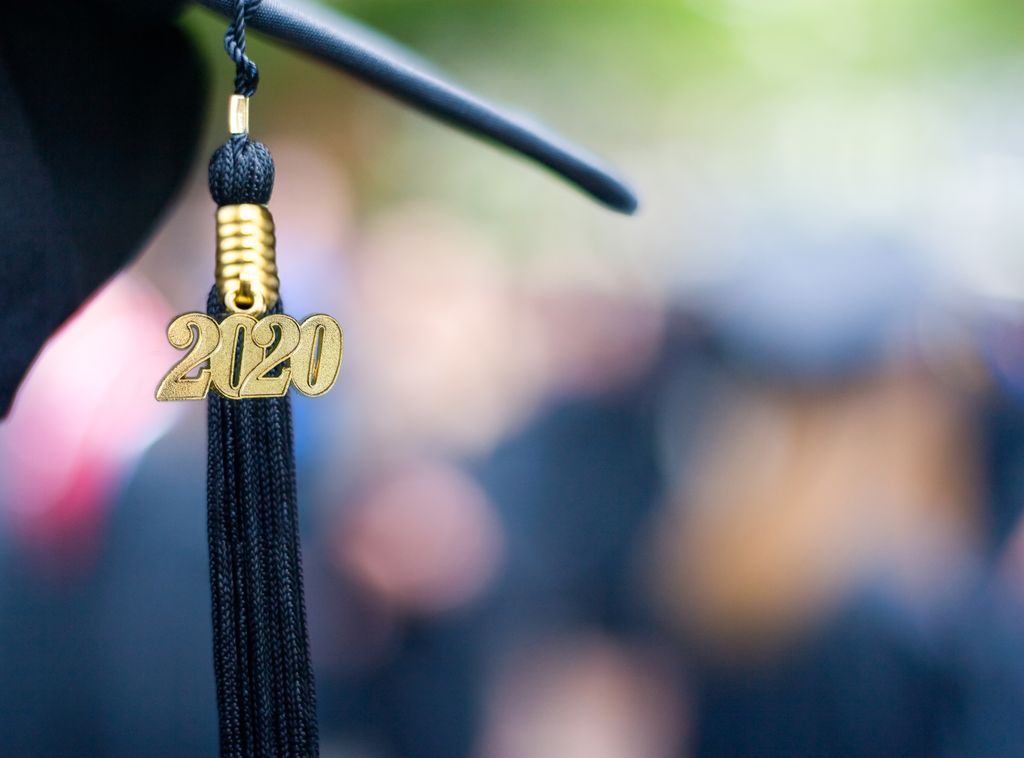 close up shot of the corner of a mortarboard with a 2020 charm on the tassel