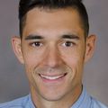 Brian C. Ricci, M.D. (OHSU) with a brown background.