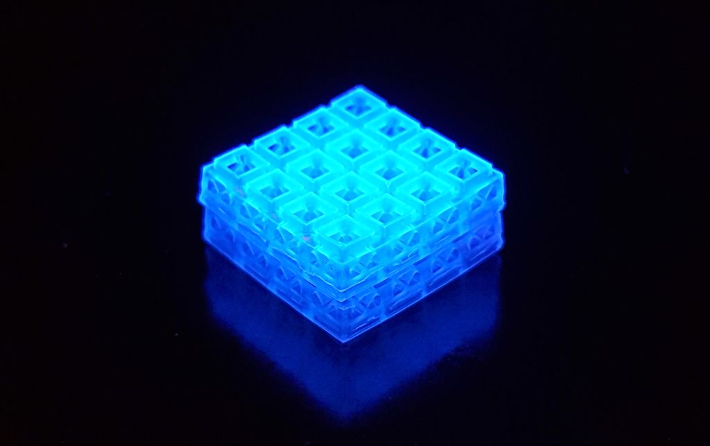 An illuminated block of interlocked 3D printed pieces