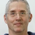 Eric Gouaux, Ph.D. (OHSU) against a gray background.