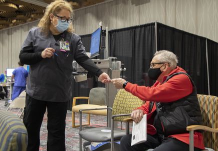 Seniors receive COVID vaccinations