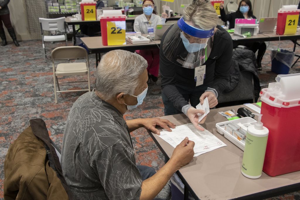 Seniors receive COVID vaccinations