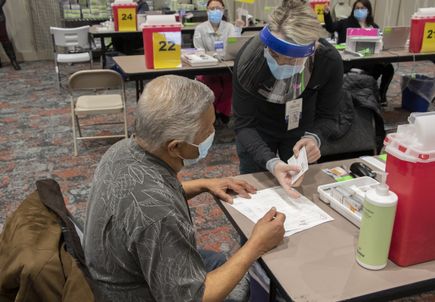 Seniors receive COVID vaccinations