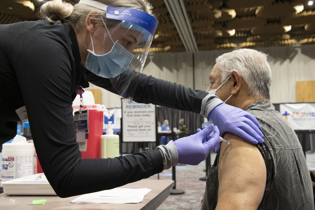 Seniors receive COVID vaccinations