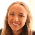 close-in headshot of Casey Thornton, a smiling young woman with long, light brown hair