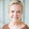 Susan Hedlund, M.S.W., director of patient and family support services at the OHSU Knight Cancer Institute. (OHSU) A woman with light hair, smiling, wearing a brown shirt.