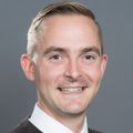 headshot of Bradley Buchheit, M.D., a smiling white man with a flattop haircut