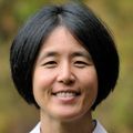 Headshot of Lina Reiss, Ph.D., a smiling Asian woman with chin-length black hair