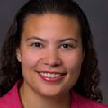 portrait of Nicole Marshall, M.D., a smiling woman with dark curly hair