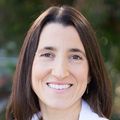 Close-in head shot of Amy Cantor, a smiling Caucasian woman with shoulder-length, straight brown hair.