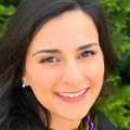 Close-in head shot of Neda Kazerouni, Pharm.D., a smiling woman with dark hair