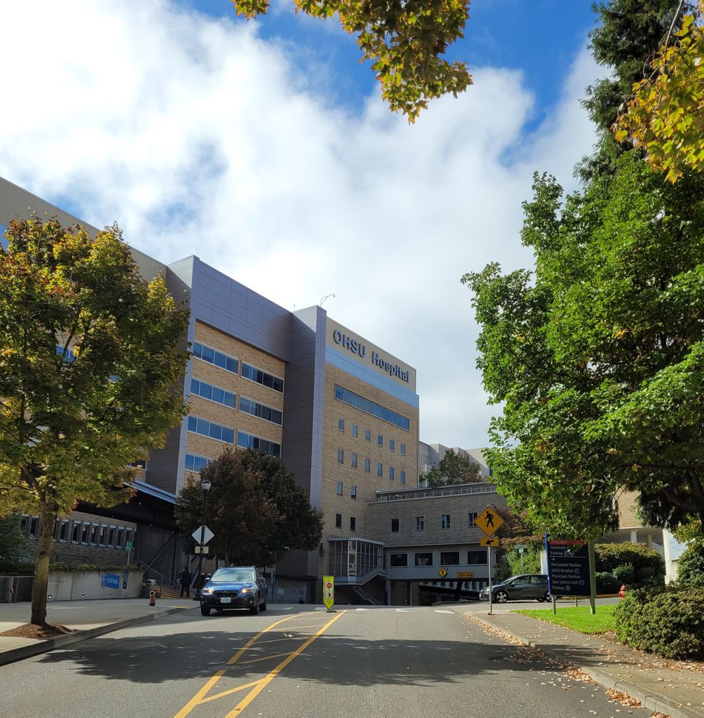 Image of the front of OHSU on a sunny autumn day.