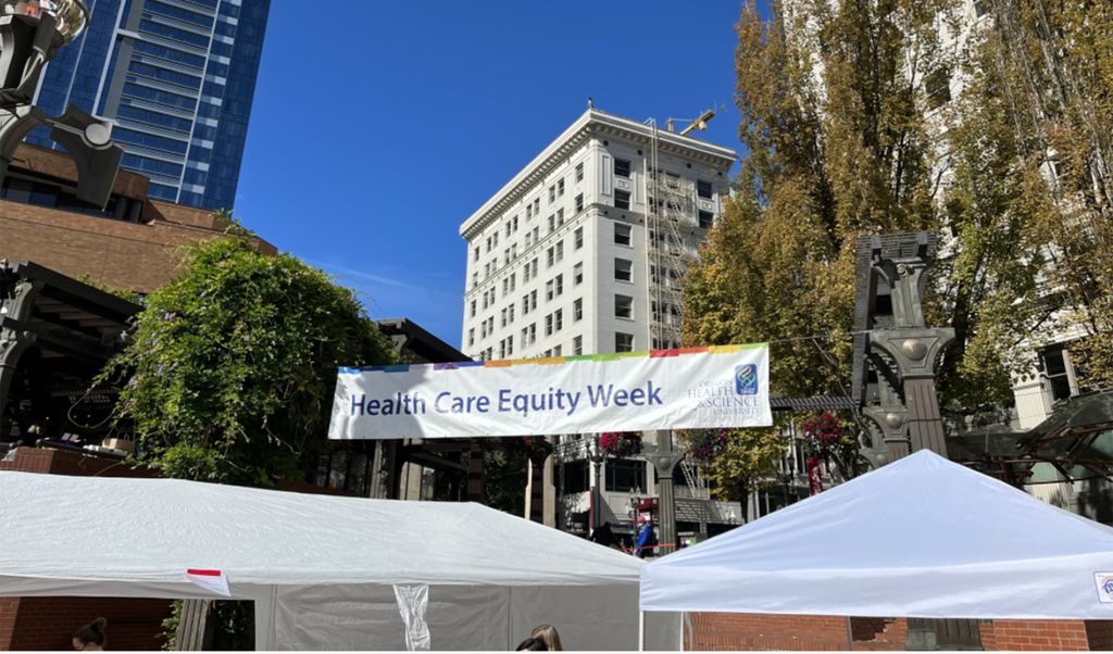 The OHSU Health Care Equity Fair was at Portland's Pioneer Courthouse Square. Image is the fair sign in the square.