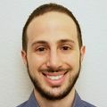 Image of Jonathan Sachs, M.D., M.P.H. at OHSU. A man with short dark hair and facial hair, smiling.