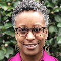 Marguerita Lightfoot Ph.D. OHSU, a woman wearing glasses and a hot pink shirt.