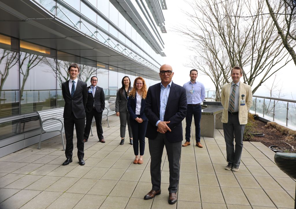 Ahmed Raslan, M.D., associate professor of neurological surgery in the OHSU School of Medicine (front center), with his students atop the OHSU mezzanine near the Portland Aerial Tram on Monday, Jan. 17, 2022.&nbsp;From left, Caleb Nerison, Joseph Nugent, Emma Richie and Brittany Stedelin. Ahmed Raslan, Edward Ward&nbsp;and Erik C. Brown (far right). (OHSU/Christine Torres Hicks)