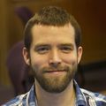 Andrew C. Adey, Ph.D. (OHSU) A man with short brown hair, and beard, smiling.