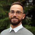 Brandon Wilder, Ph.D. (OHSU) A man with brown hair and beard, smiling.