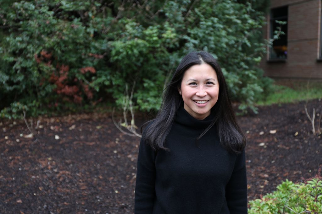 Jamie Lo, M.D., M.C.R. stands outside the Vaccine and Gene Therapy Institute at OHSU.
