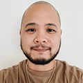 Kael Tarog (Courtesy of Tarog); a person with no hair, a thin dark beard, smiling.