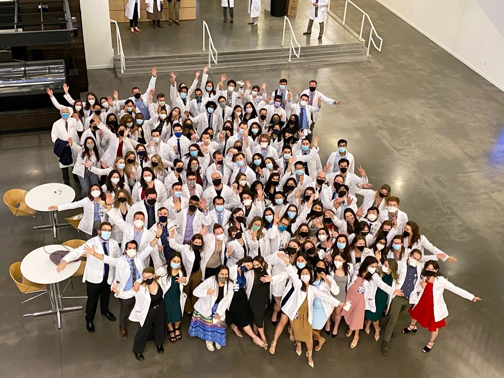 OHSU M.D. Class of 2024  White Coat Ceremony: group of people cheering