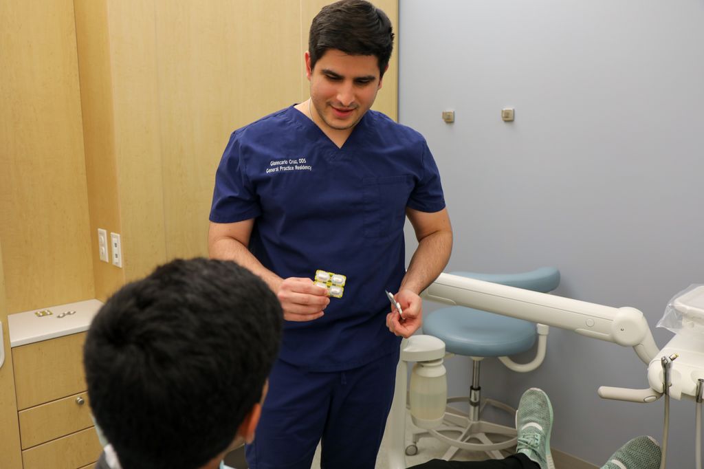 OHSU's Gianncarlo Cruz, DDS, consults a patient on a safe level of pain management on Tuesday, Nov. 1, 2022, at the OHSU School of Dentistry in Portland.&nbsp;(OHSU/Christine Torres Hicks)