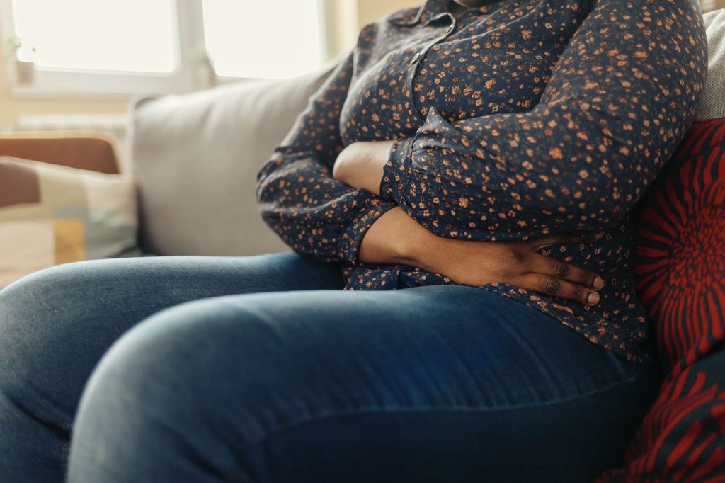 A woman holding her abdomen in pain. About 1 to 2% of all pregnancies are ectopic, meaning an embryo is implanted in a fallopian tube or otherwise outside the uterus, and cannot develop normally. (Getty Images)