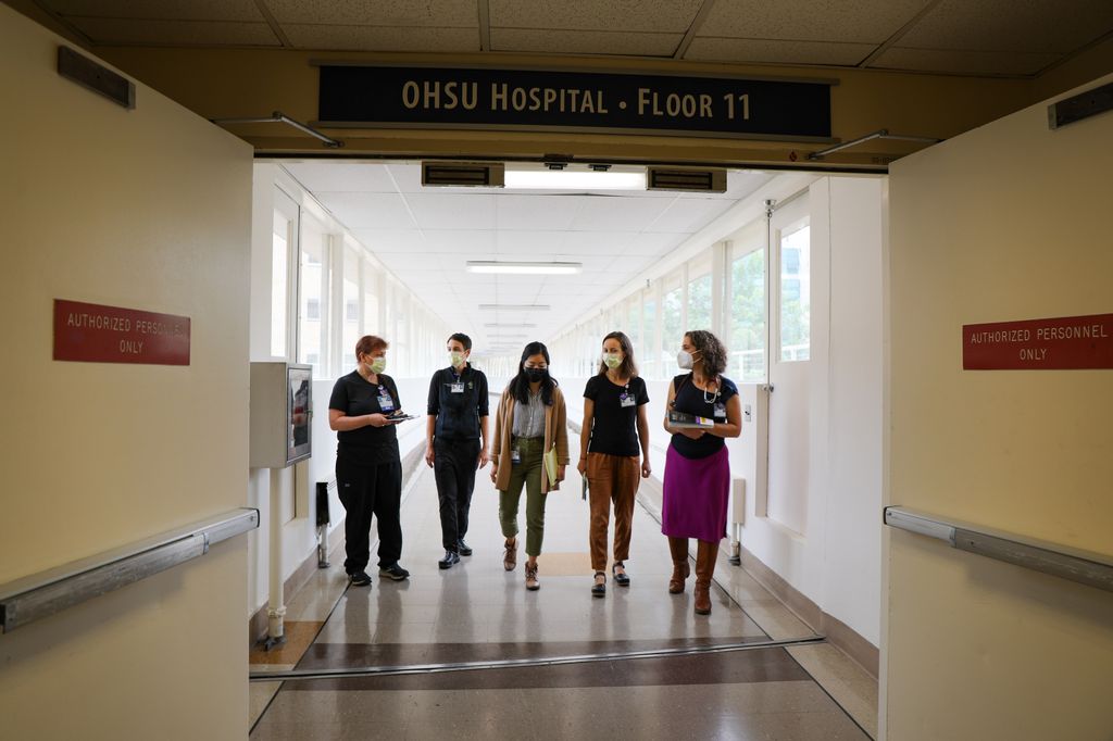 OHSU's Project IMPACT walks through the hospital to treat patients. Project IMPACT is&nbsp;a group of addiction medicine specialists from Oregon Health & Science University who often meet patients in the hospital who seek addiction recovey. The team&nbsp;advocates for&nbsp;patients in need of treatment to get individualized care as they often are forced to navigate a punishing gauntlet to get the care they need. (OHSU/Christine Torres Hicks)