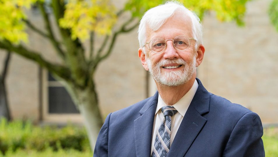 David Jacoby named dean of OHSU School of Medicine. Here he is standing in a garden, smiling.