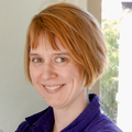 Jane Lange, Ph.D., a person with red hair, smiling.