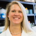 Rosie Sears, Ph.D. (OHSU) A person with medium blond hair, smiling.