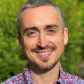 Chris Stauffer, M.D. (OHSU) is a person with short black and gray hair, facial hair, smiling.