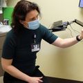 Marian Dale, M.D., M.C.R., with patient