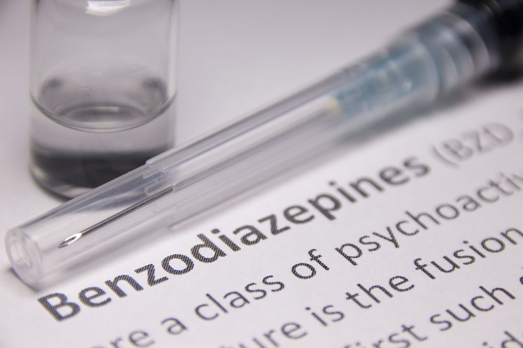Benzodiazepines use and clinical risks. Image is a paper explaining benzodiazepines next to the medication.