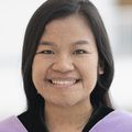 Thao 'Jane' Cao (OHSU) stands near a window.