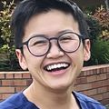 Dr. Olives Nguyen stand near OHSU Hillsboro sign.
