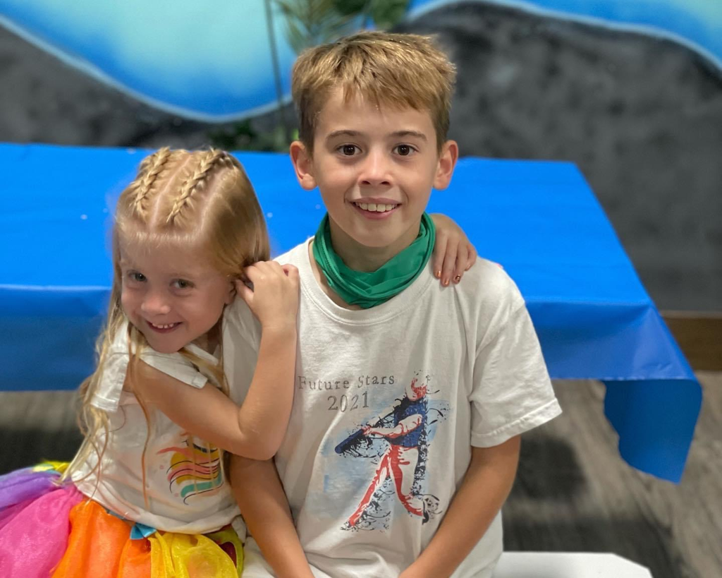 Khovny Vignery hugs her brother Evan.
