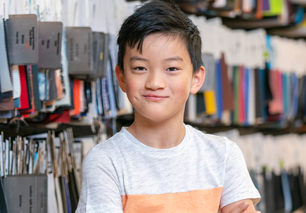 Jaren Heacock stands by fabric swatches.