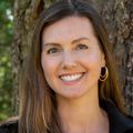 Quin Denfeld, Ph.D., RN, FAHA, stands by a tree.