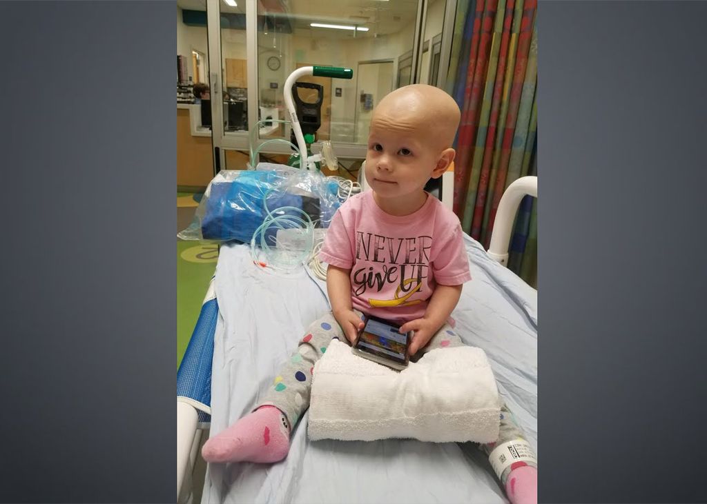 Brielle, a young cancer survivor who received treatment at OHSU, shown here in her hospital bed, received sodium thiosulfate following several chemotherapy sessions. (Courtesy of Jennifer Boesche)