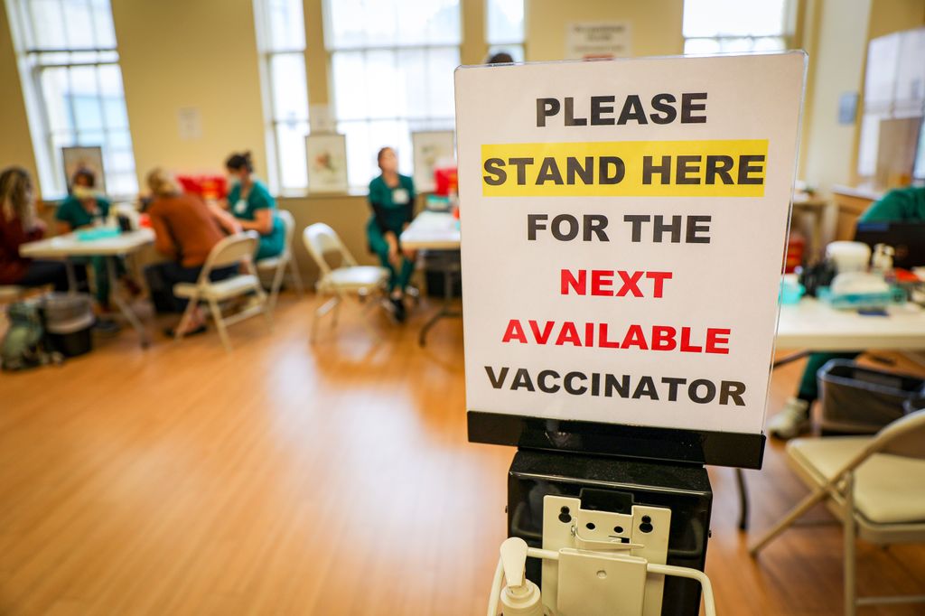 A vaccination clinic at OHSU. New laboratory research from OHSU suggests vaccine boosters should be spaced no more frequently than a year apart, at least among healthy people. (OHSU/Christine Torres Hicks)