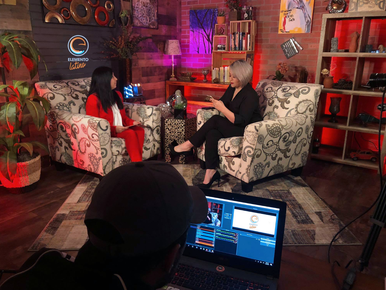 Elemento Latino, an independent Spanish-language television program, aimed to inform and support the Latino/a/x/e community in accessing resources and navigating systems. Vázquez interviews Mariana Valenzuela on the Elemento Latino set. (Courtesy of ICG)