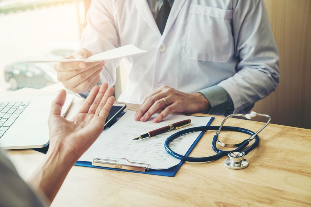 Doctor prescribing medication. Authors of a new study call for a national program to train internal medicine residents about the benefits of offering pre-exposure prophylaxis, or PrEP to patients at high risk of HIV exposure. (Getty Images)