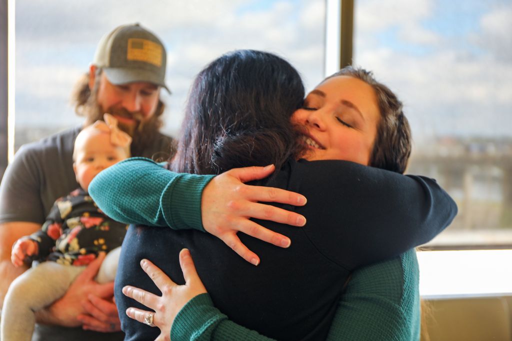 Hailee and Quaid Busk bring their daughter, Blakely, back to OHSU for a checkup following her life-saving operation in April. (OHSU/Christine Torres Hicks)